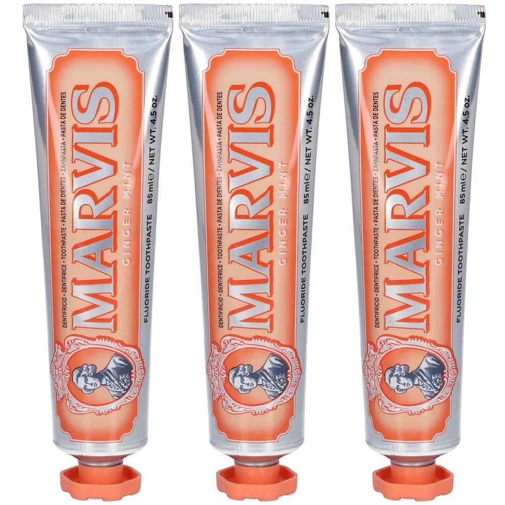 Drie tubes Marvis Ginger Mint fluoride tandpasta met oranje label en zilveren dop.