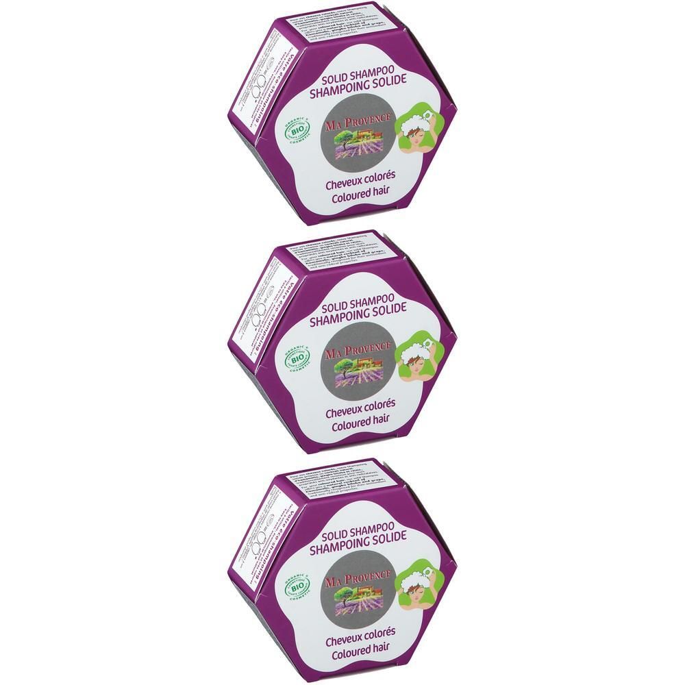 Trois boîtes hexagonales de shampoing solide pour cheveux colorés.