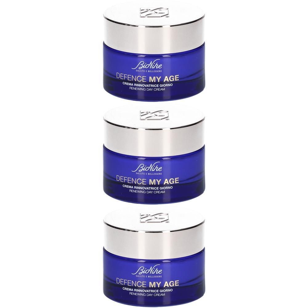 Trois pots de crème de jour BioNike Defence My Age bleus avec couvercles argentés.