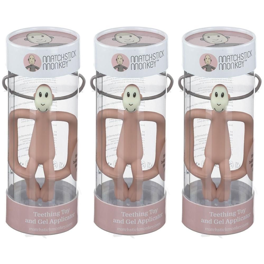 Anneau de dentition Matchstick Monkey vieux rose, dans son emballage cylindrique.