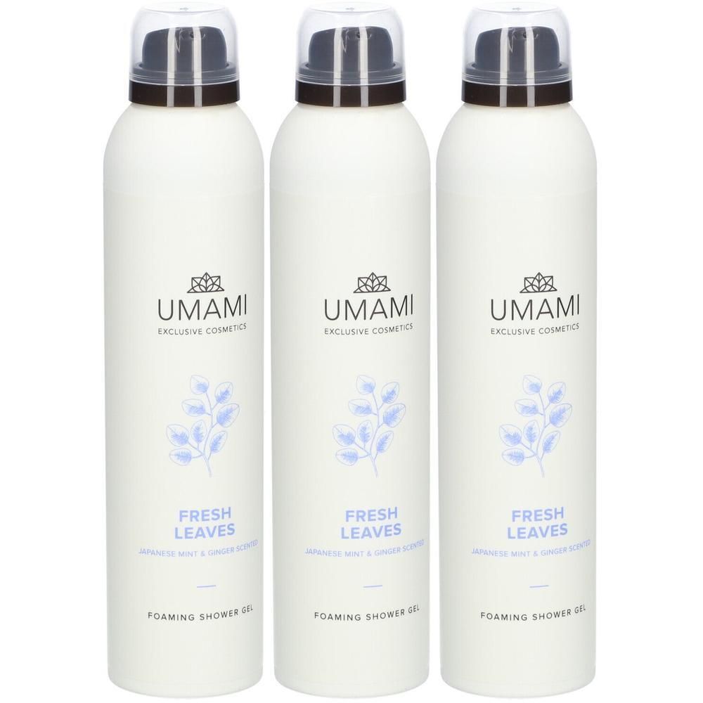 Trois flacons blancs de gel douche UMAMI avec logo et motif de feuilles. "FRESH LEAVES" et "FOAMING SHOWER GEL" sont imprimés.
