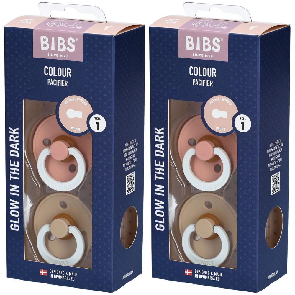 Deux paquets de sucettes BIBS Colour, taille 1, rose et beige. Brille dans le noir.