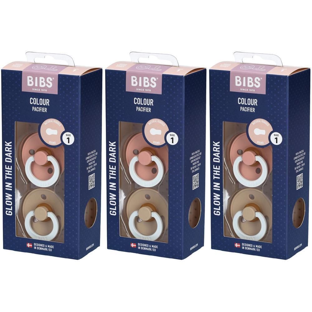 Trois paquets de sucettes BIBS Colour, taille 1, en rose et beige.