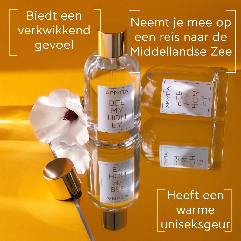 Apivita Bee My Honey Eau de Toilette fles, nog een fles ernaast, een bloem.