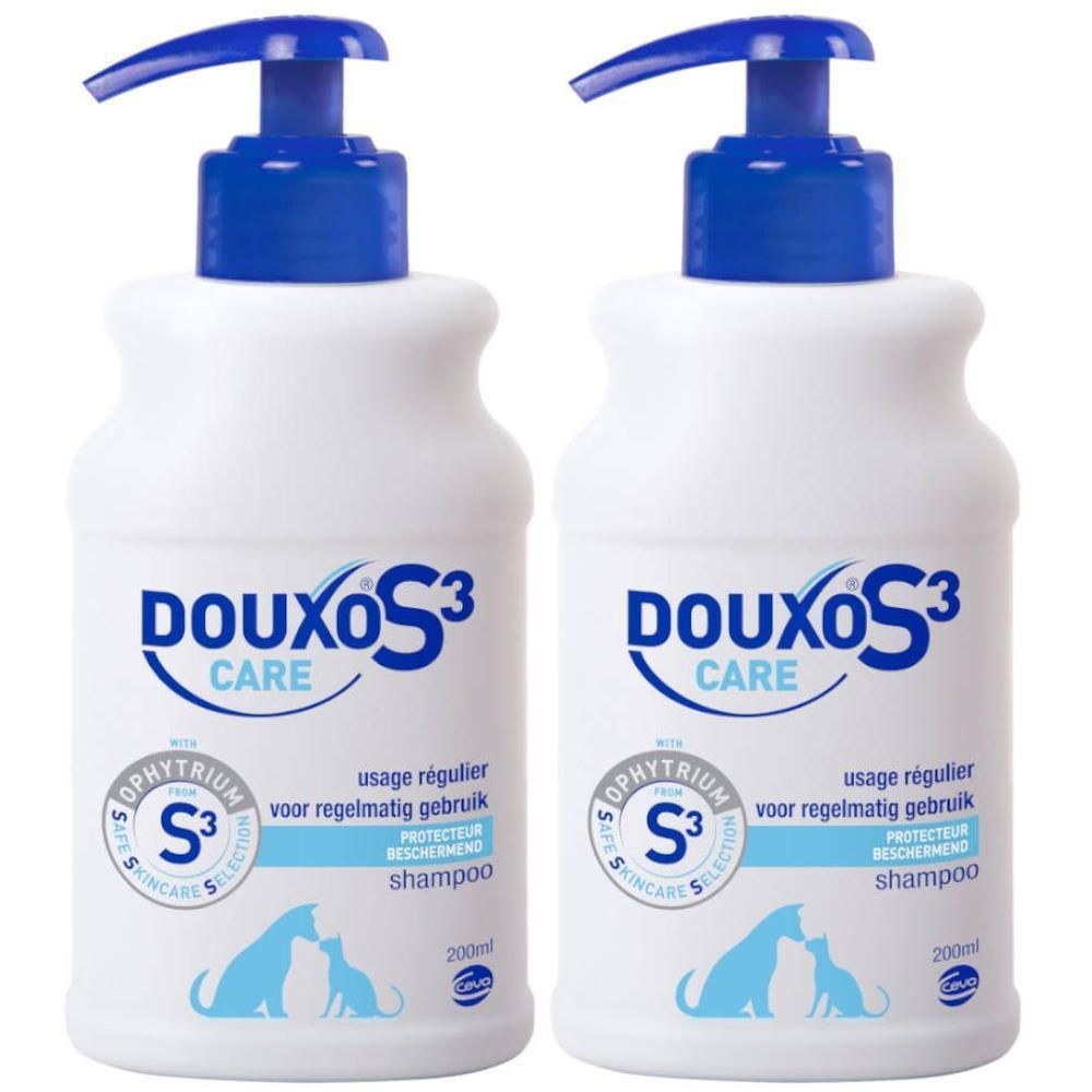 Twee witte flessen DOUXO S3 Care shampoo met blauwe pompen. 200ml.