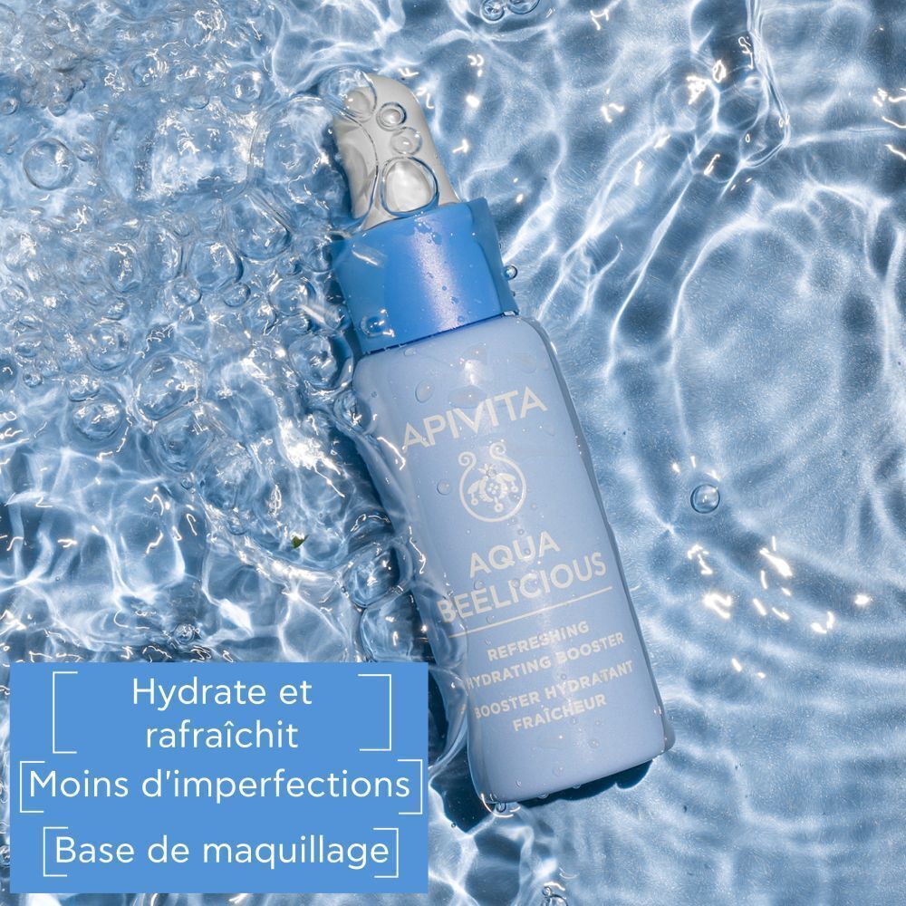 Un flacon bleu avec pipette dans de l'eau pétillante, Apivita Aqua Beelicious.