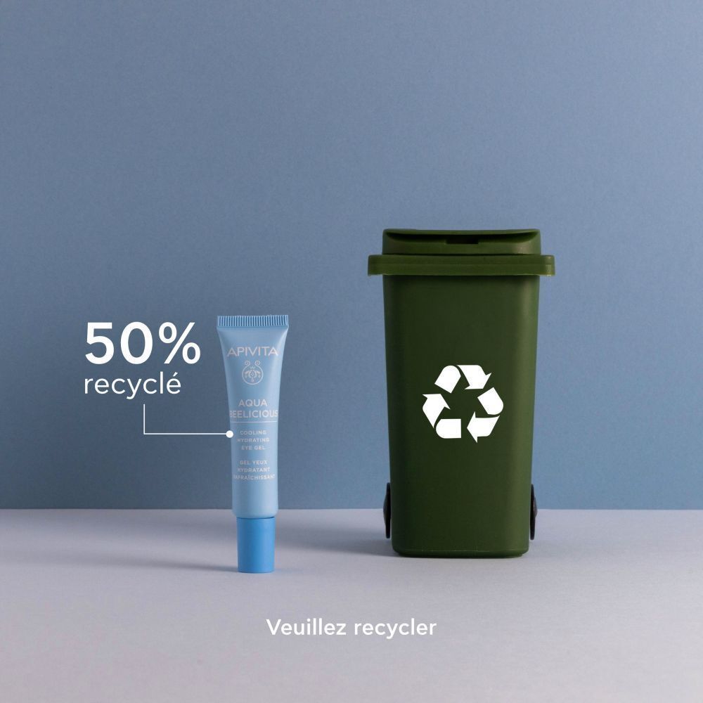 Apivita Aqua Beelicious Gel Yeux à côté d'une poubelle de recyclage verte. 50% recyclé.