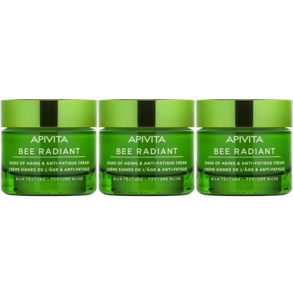 Drie groene potjes Apivita Bee Radiant crème naast elkaar.