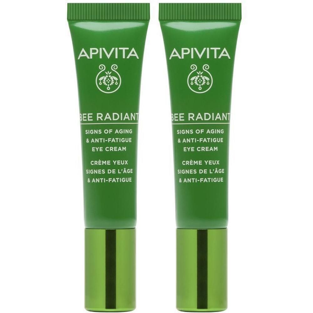 Twee groene tubes Apivita Bee Radiant oogcrème naast elkaar.