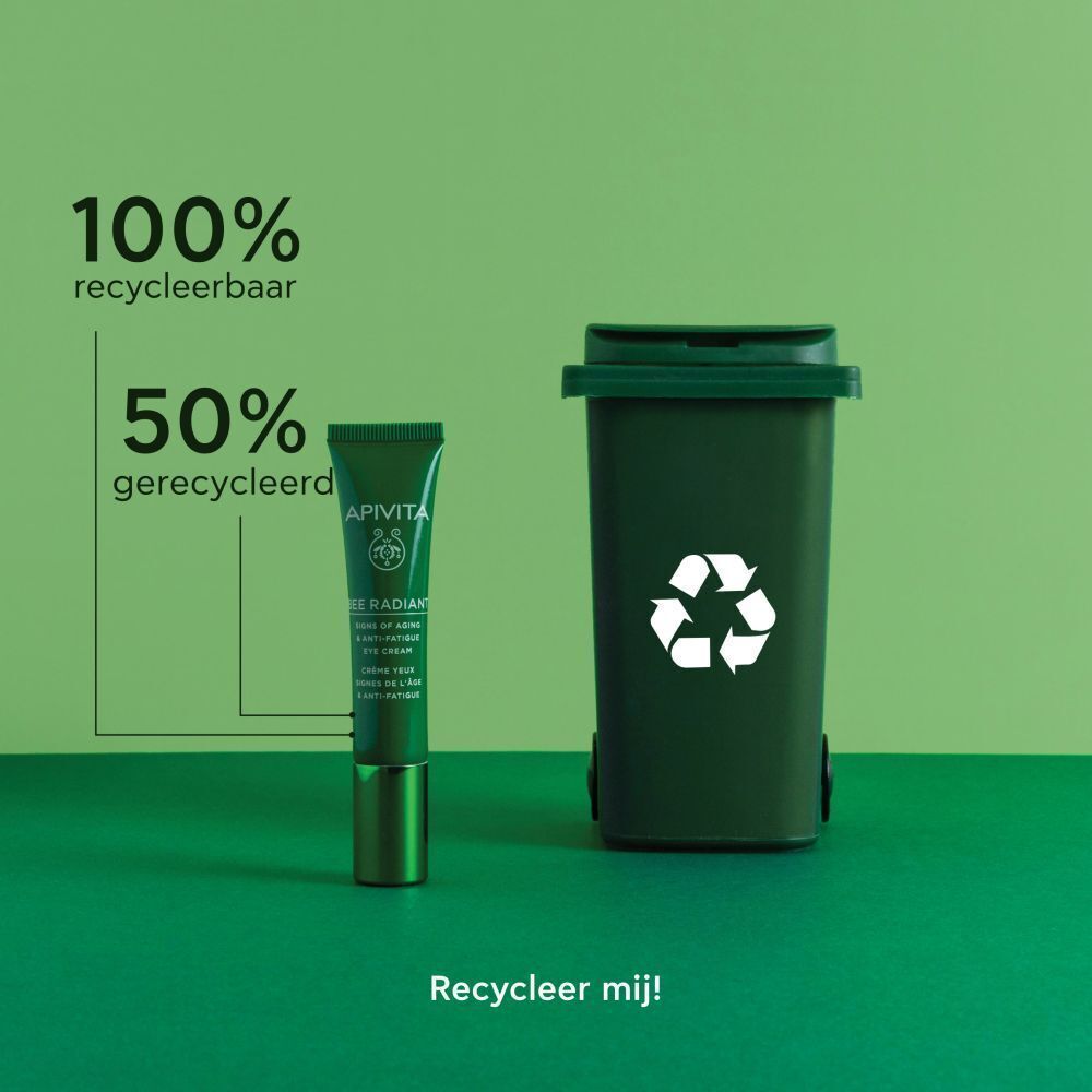 Apivita Bee Radiant oogcrème naast een kleine groene prullenbak met recycling-symbool.