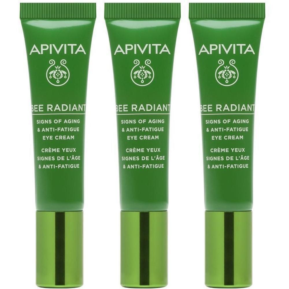 Drie groene tubes Apivita Bee Radiant oogcrème naast elkaar.