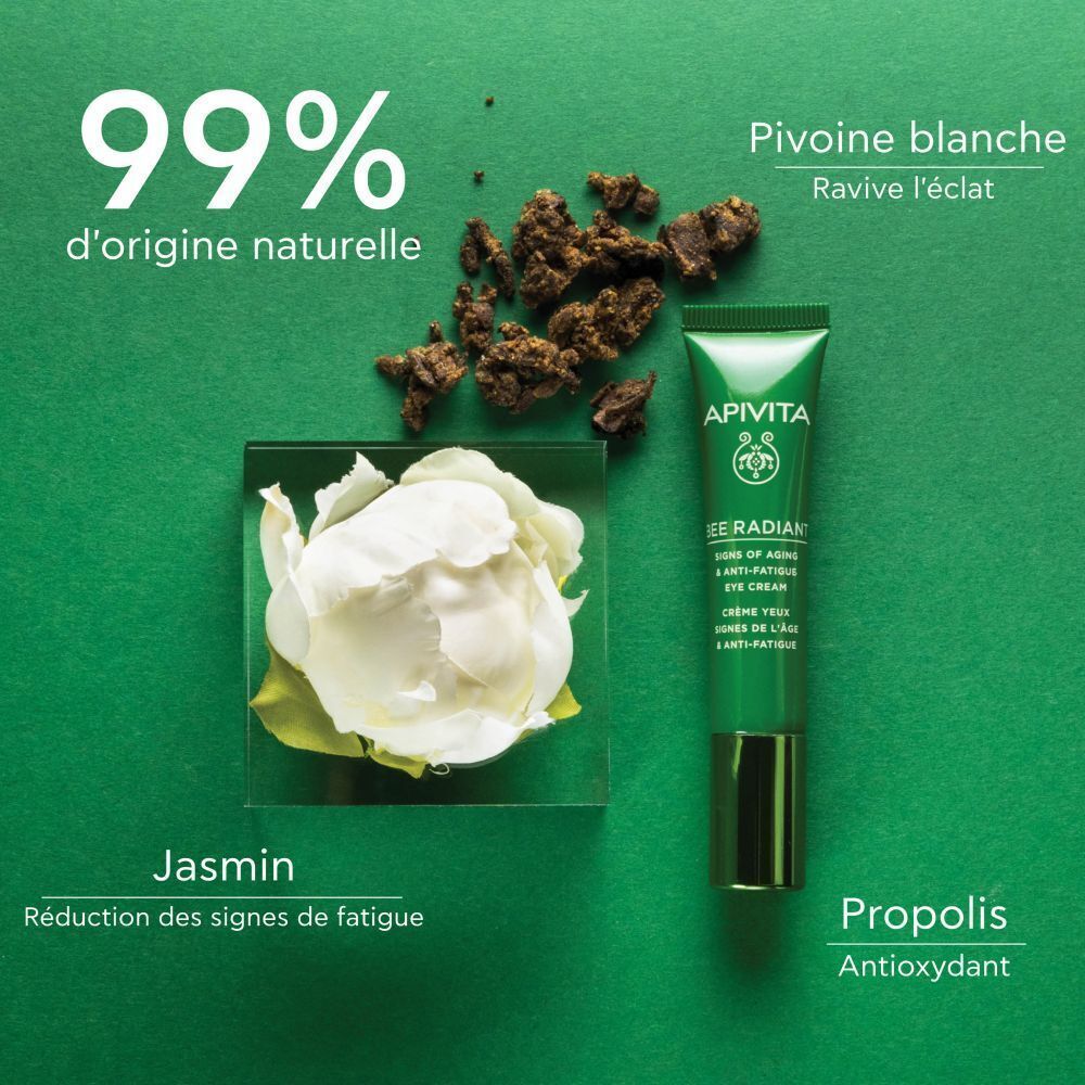 Crème contour des yeux Apivita Bee Radiant à côté de fleur de jasmin, propolis et pivoine blanche. 99% d'origine naturelle.