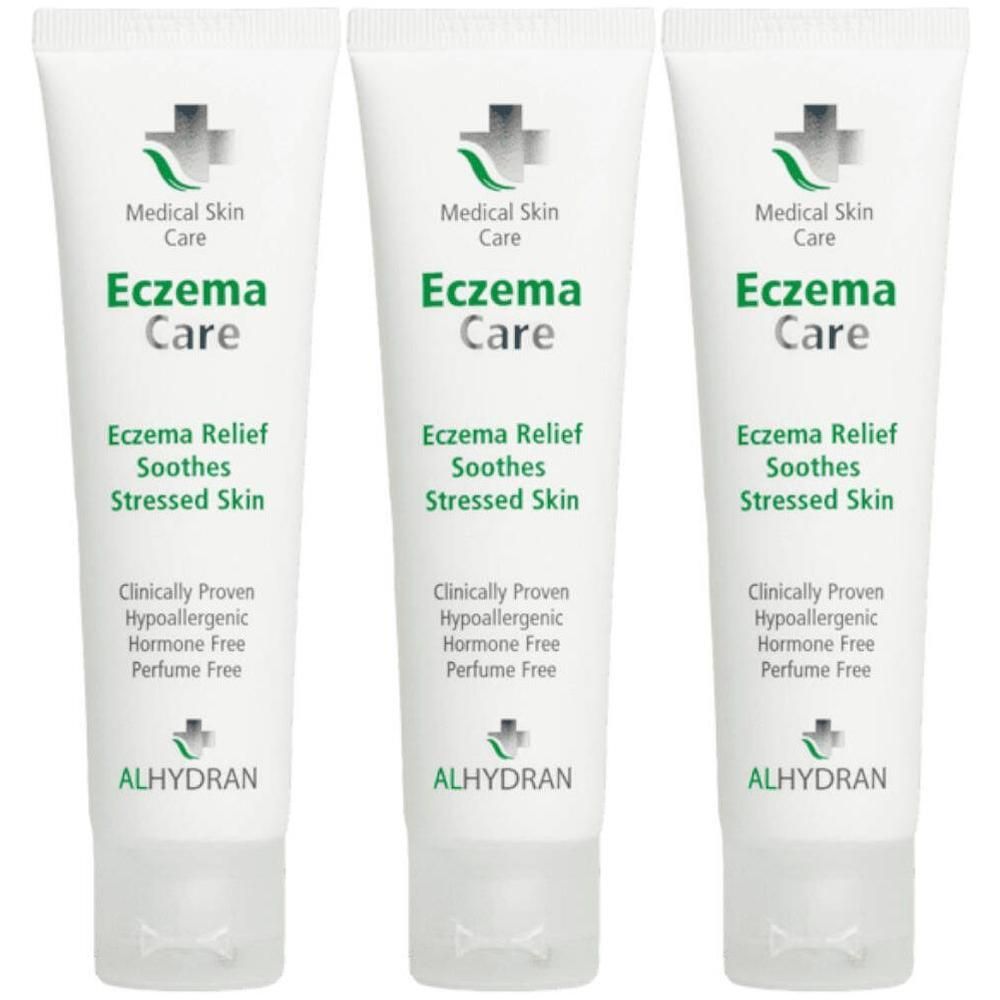 Trois tubes blancs Alhydran Eczema Care avec inscription verte et logo de croix médicale.