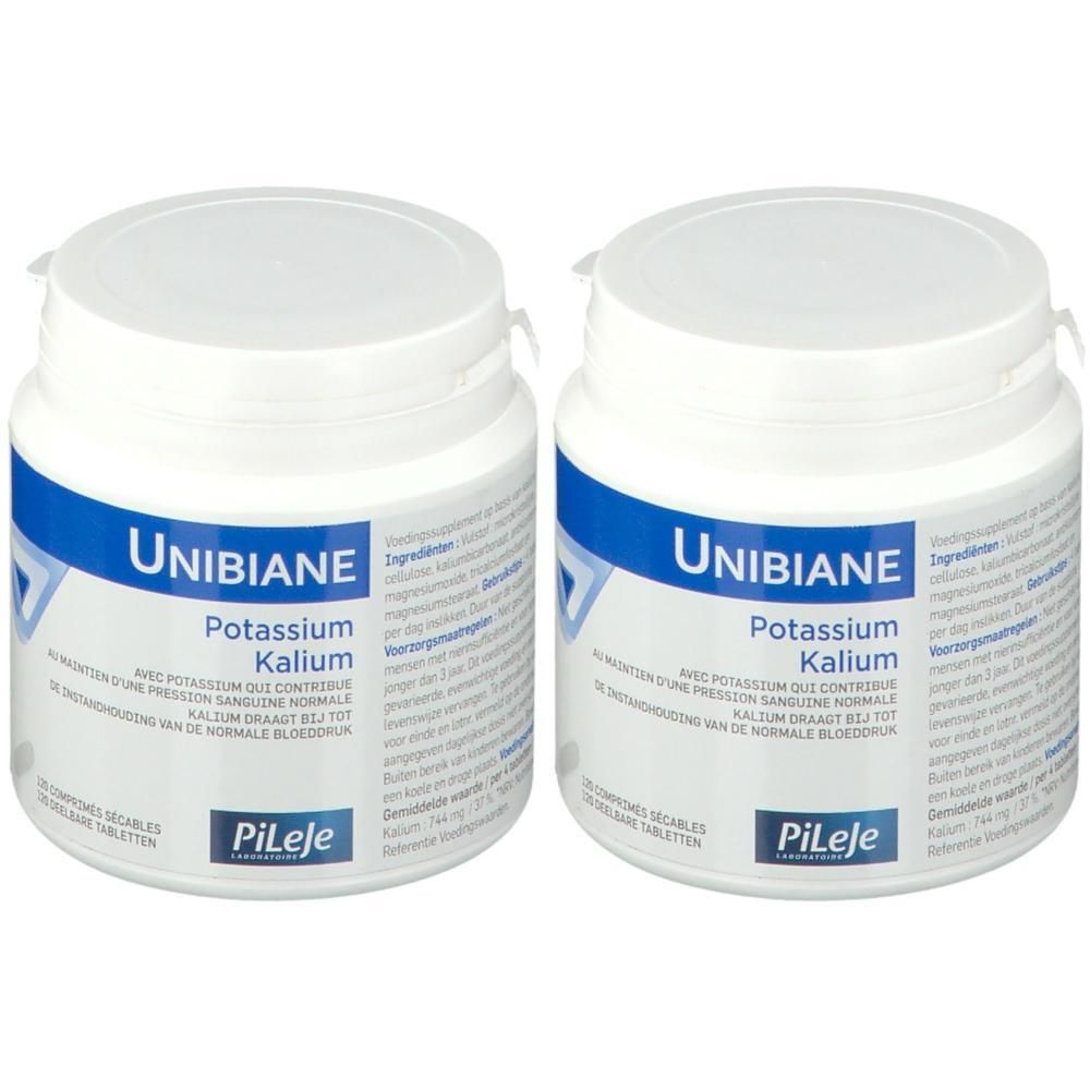 Twee witte potjes met Unibiane Kalium tabletten. Blauwe etiketten met productinformatie en Pileje logo.