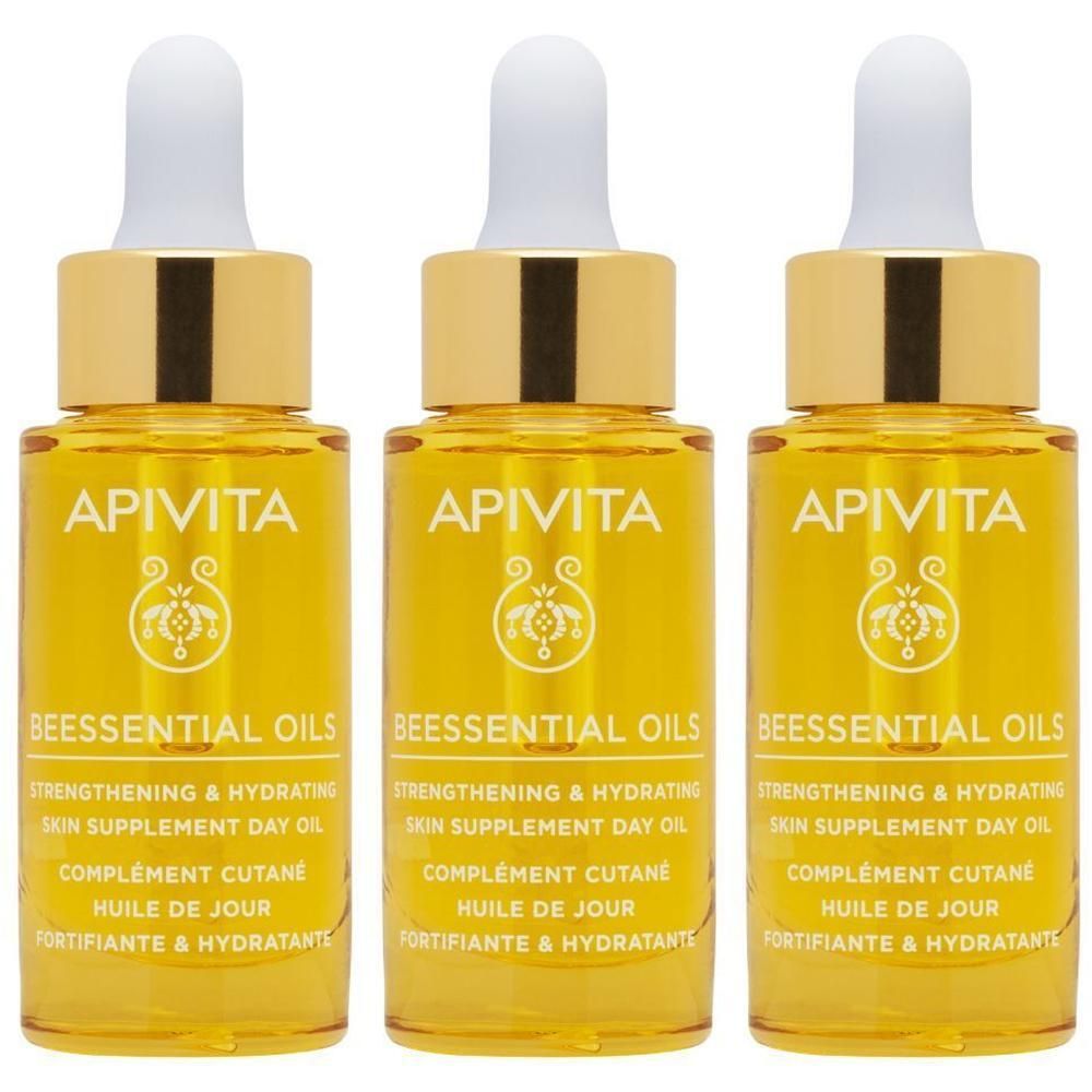 Trois flacons d'Huile de Jour Apivita Beessential Oils avec compte-gouttes.