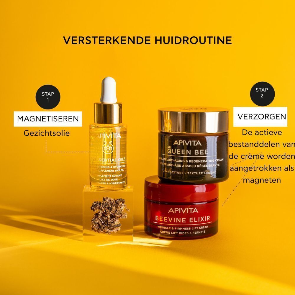Flesje Apivita Huidolie en twee crèmepotjes voor een gezichtsverzorgingsroutine.
