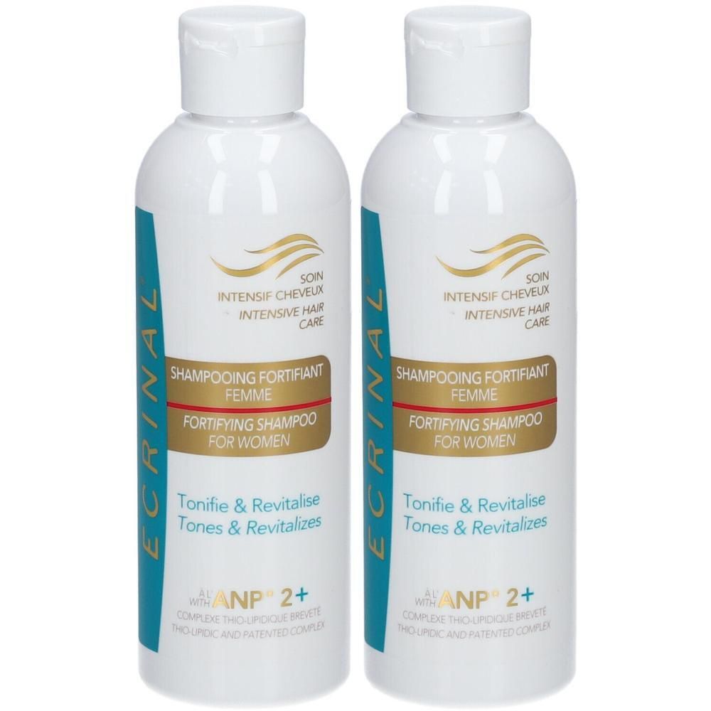 Deux flacons de shampoing fortifiant Ecrinal ANP2+ pour femmes. Blanc avec accents bleus et dorés.
