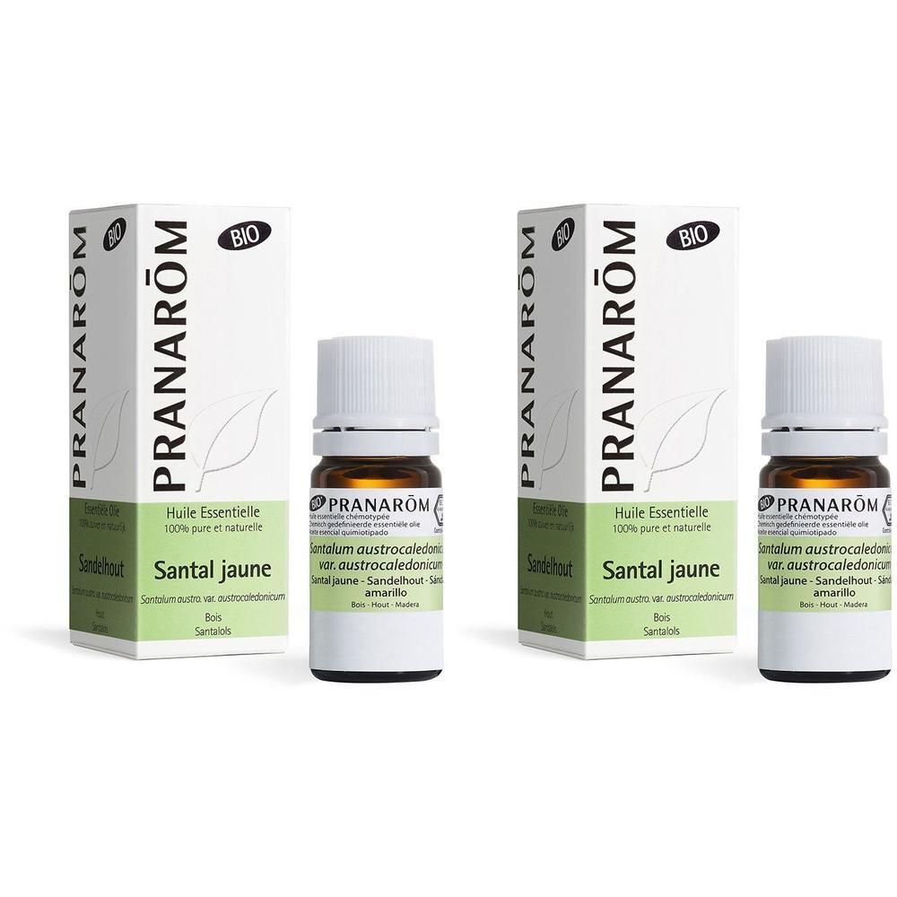 Deux flacons d'huile essentielle de Santal Jaune Bio avec emballage. Logo PranaRöm et label Bio visibles.