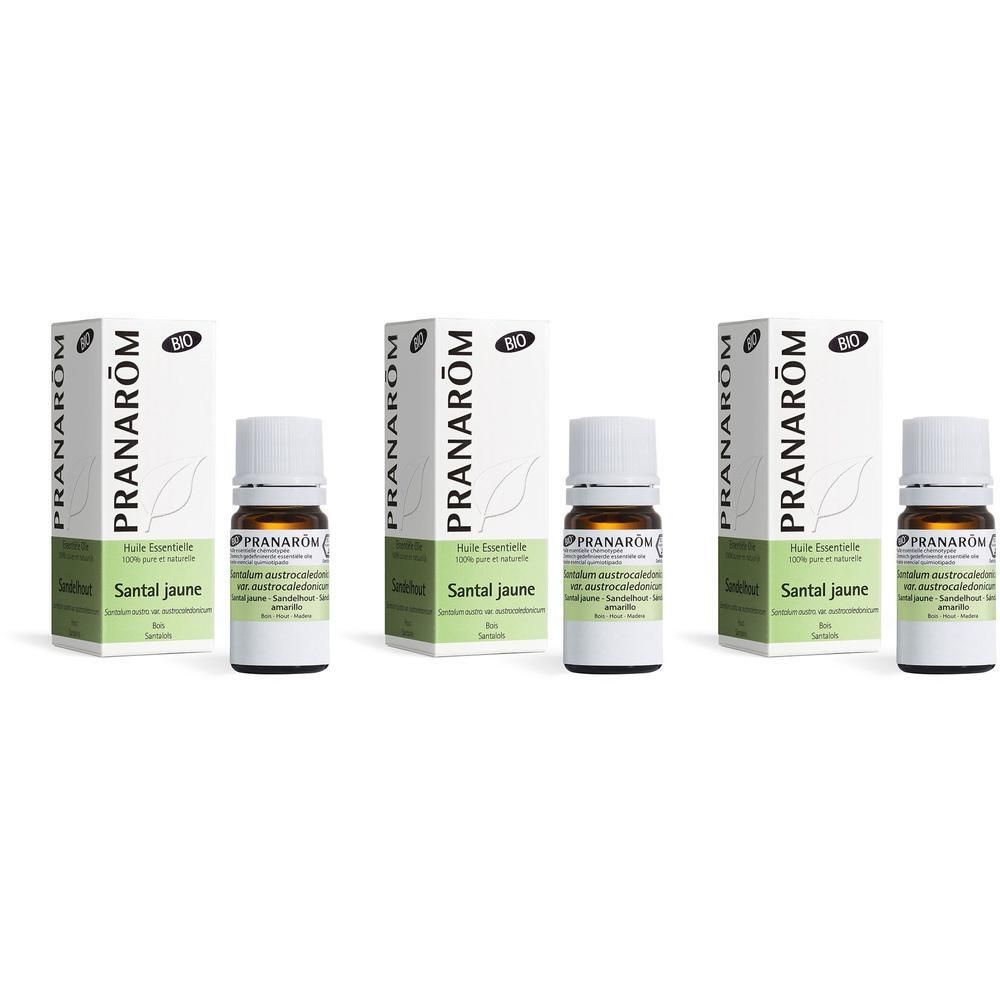 Trois flacons d'huile essentielle de Santal Jaune Bio avec leurs boîtes.