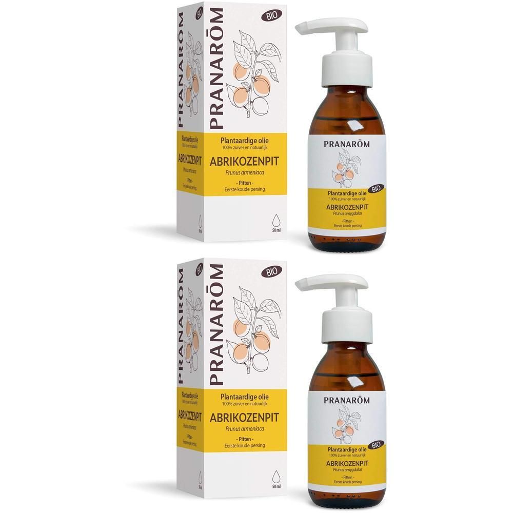 Twee dozen en flessen Pranarôm biologische abrikozenpitolie met pompdispenser.