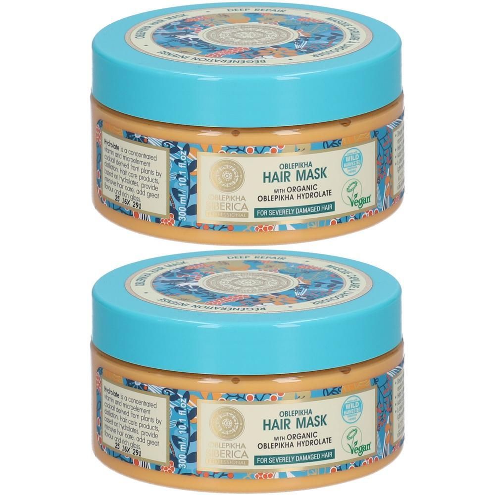 Twee potten haarmasker met turquoise deksels. Het etiket vermeldt "Oblepikha Hair Mask".