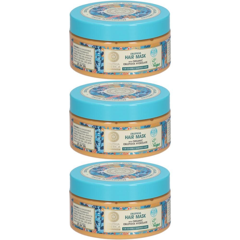 Drie potten haarmasker met blauwe dop en oranje etiket.