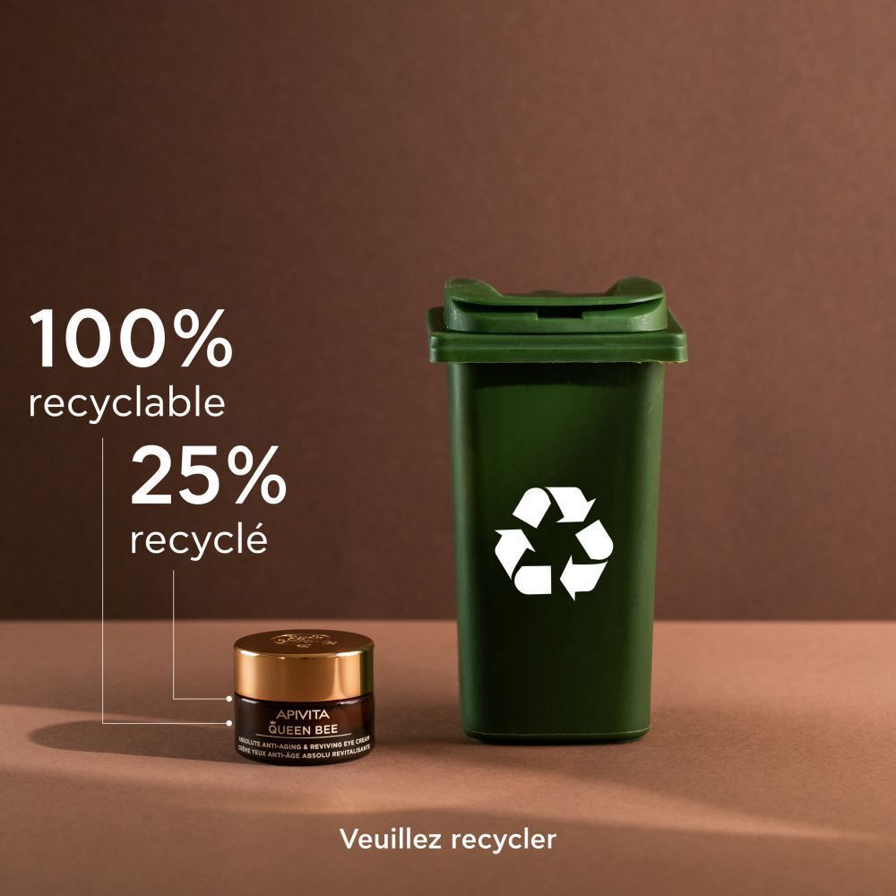 Crème contour des yeux Apivita Queen Bee à côté d'une poubelle de recyclage, 100% recyclable.