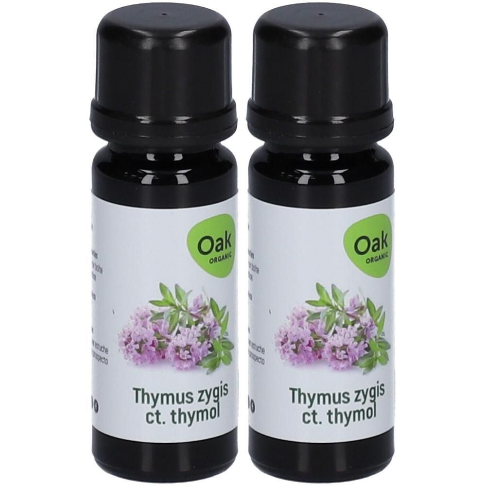 Twee flesjes Oak Organic Thymus zygis ct. thymol etherische olie met tijm-bloemenillustratie.