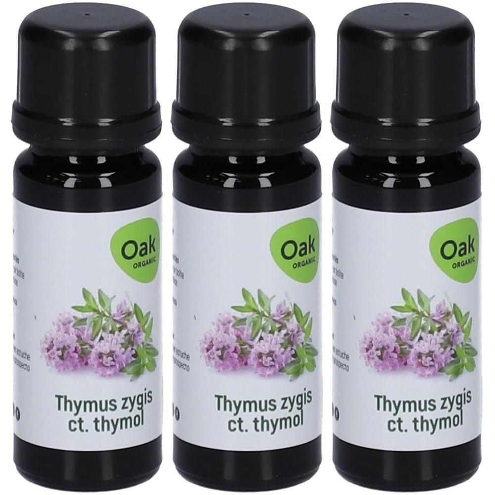 Drie flessen Oak Organic Thymus Zygis ct. Thymol etherische olie met illustratie van tijmstruikjes.