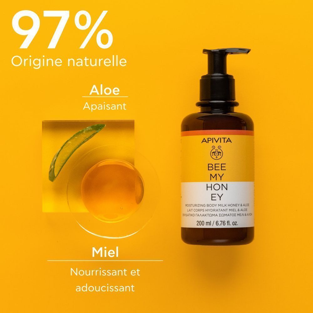Flacon pompe près d'aloès et de miel, fond jaune.