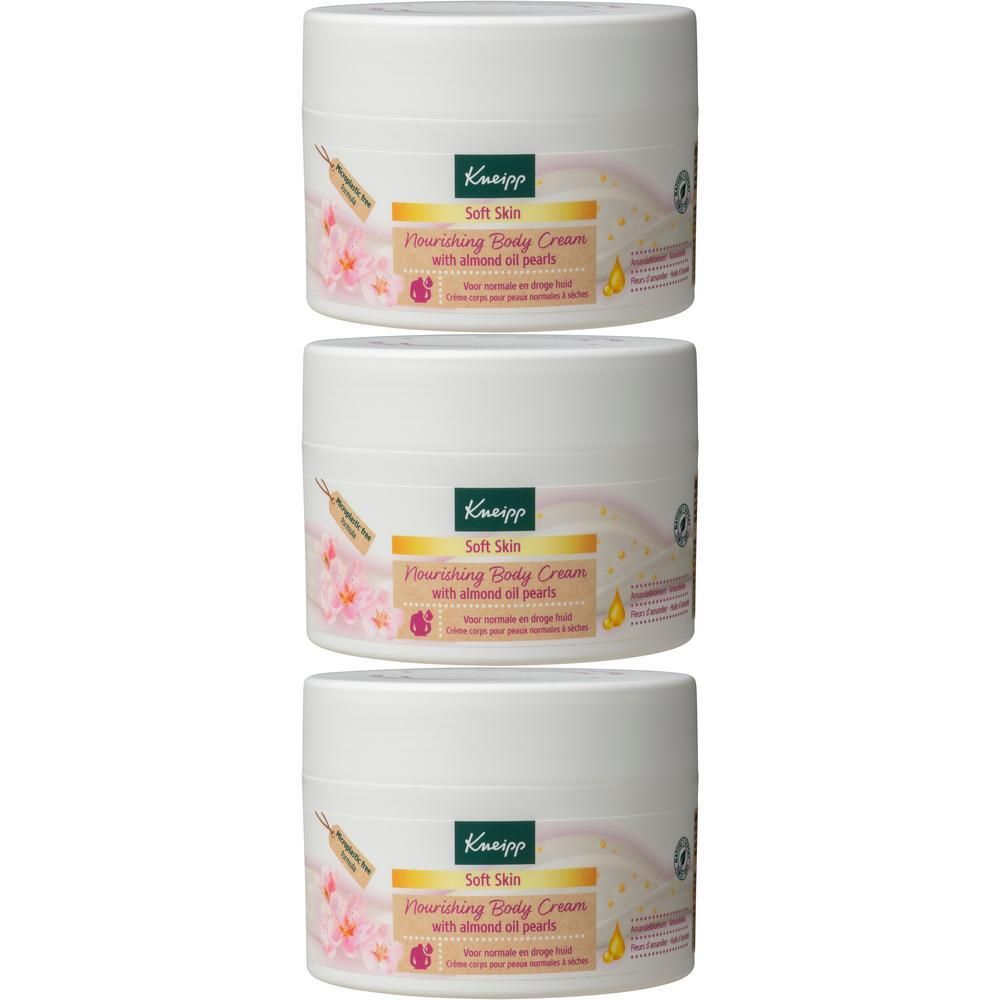 Drie witte potten Kneipp bodycrème met amandelolieparels.