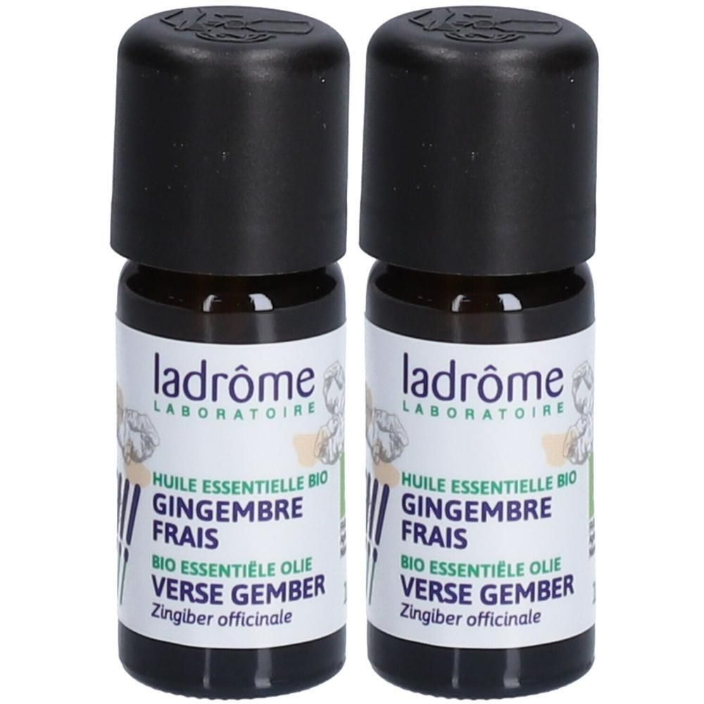 Deux flacons d'huile essentielle de gingembre Ladrôme. Bouchon noir, verre brun. Étiquette avec illustration végétale.