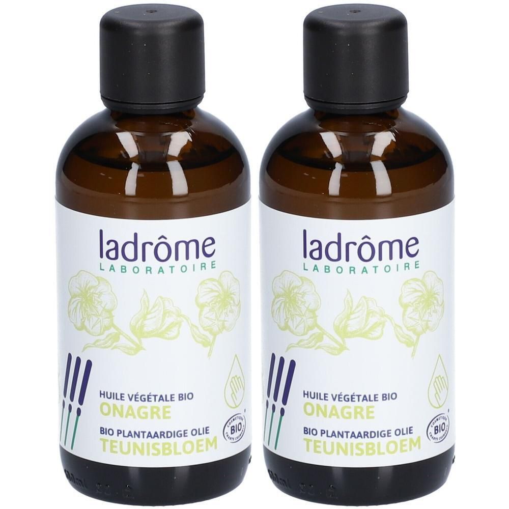 Deux flacons d'huile végétale bio de Ladrôme. Flacons en verre brun avec bouchons noirs et étiquettes blanches.