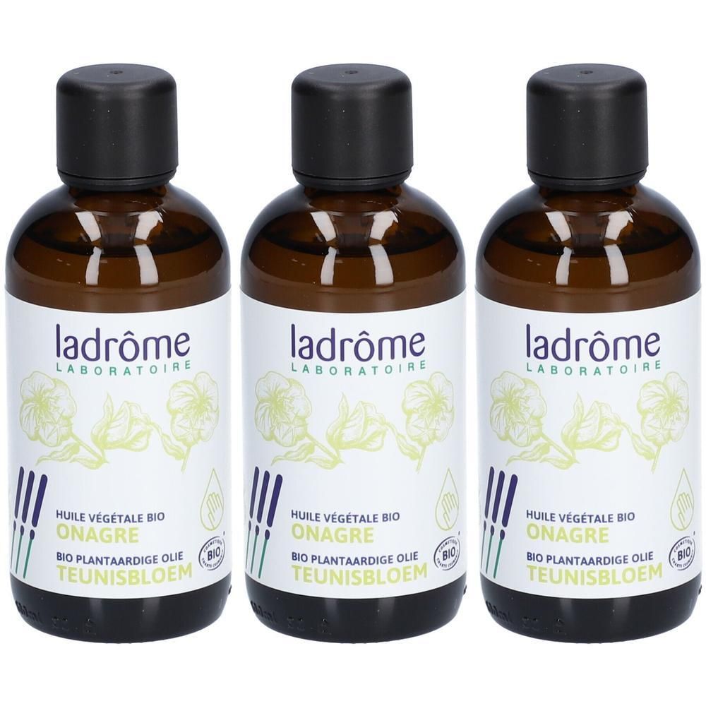 Trois flacons d'huile végétale bio de Ladrôme. Flacons en verre brun avec bouchons noirs et étiquettes blanches.