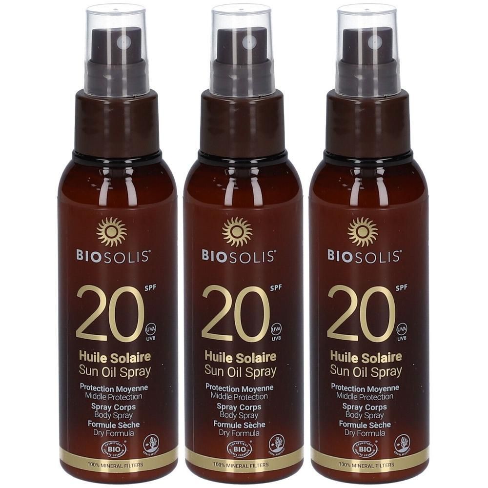 Trois flacons de Biosolis Huile Solaire Spray SPF 20 avec tête de pompe. Flacons marron avec étiquette dorée.