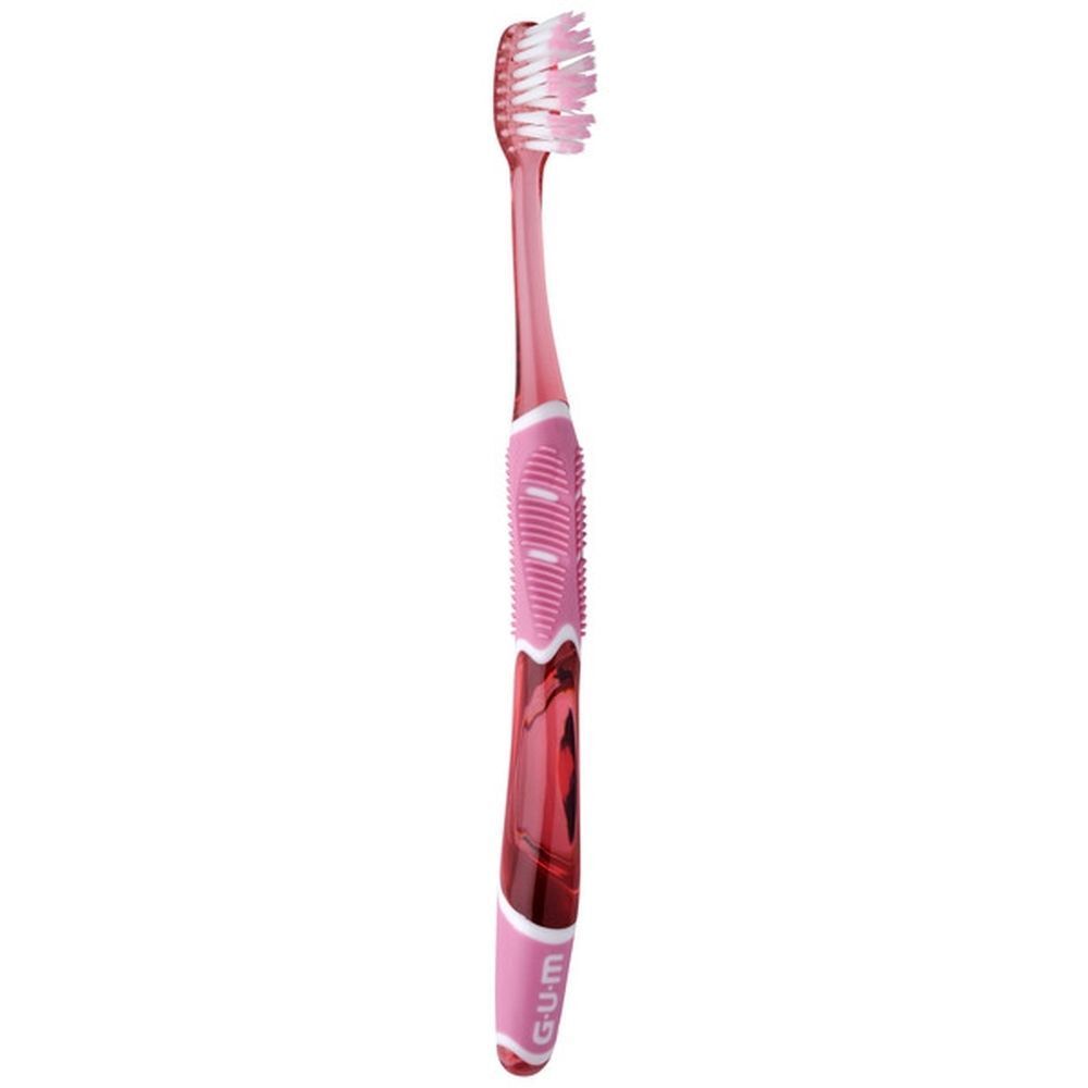 Een GUM Pro Sensitive tandenborstel met roze borstels en handvat.