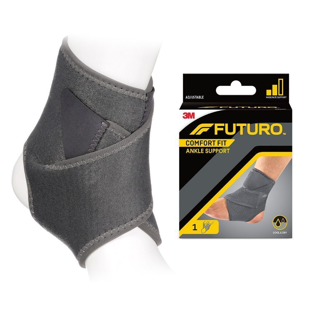 Genouillère FUTURO Comfort Fit sur une jambe, à côté de son emballage.