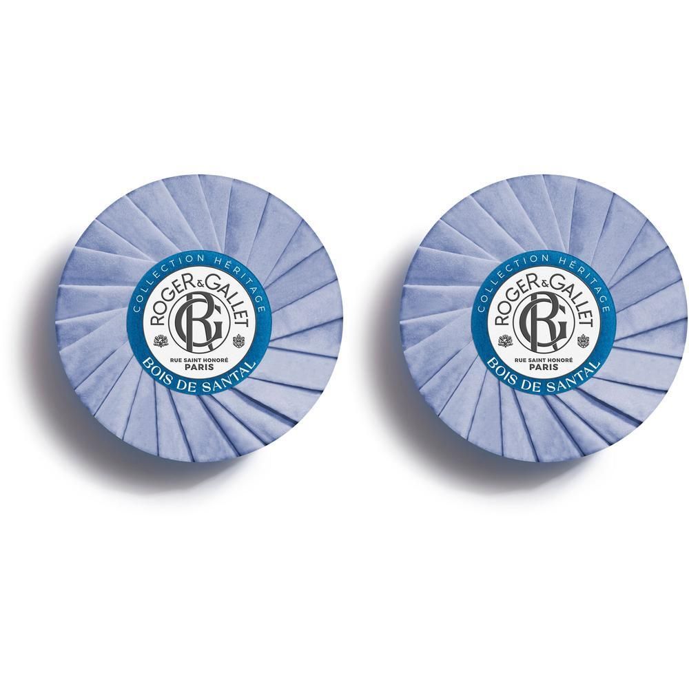 Twee ronde zepen in blauwe papieren verpakking met logo.