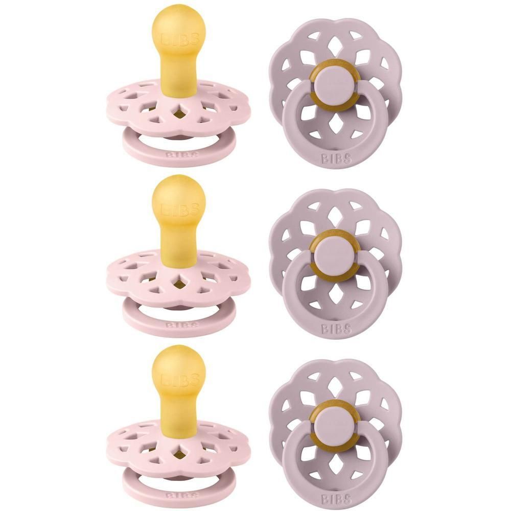 Trois suces BIBS roses avec tétine jaune et bouclier ajouré.