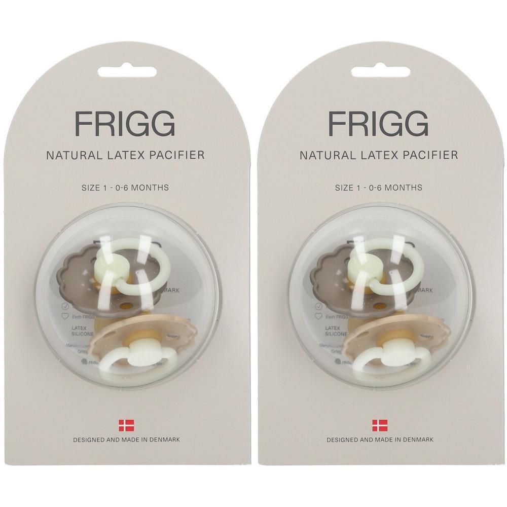 Twee FRIGG natuurrubber spenen, maat 1 (0-6 maanden), in verpakking. Beige en lichtgroene spenen met witte greep.