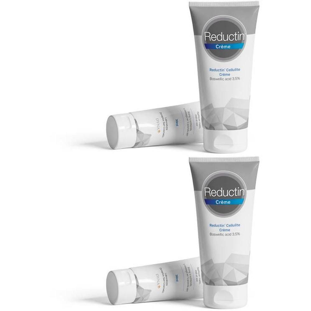 Twee tubes Reductin Cellulite Crème met geometrisch patroon.