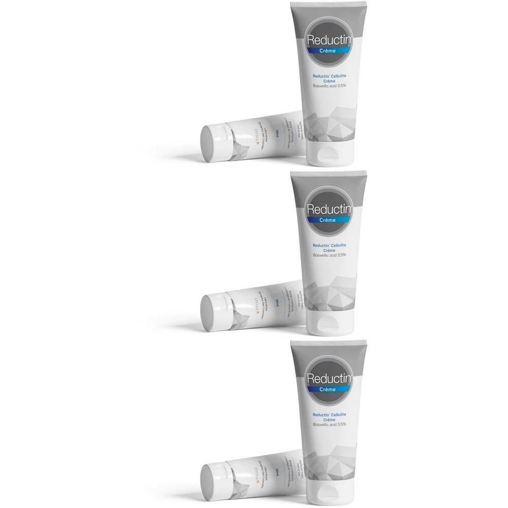 Trois tubes de crème Reductin Cellulite avec un motif géométrique sur fond blanc.