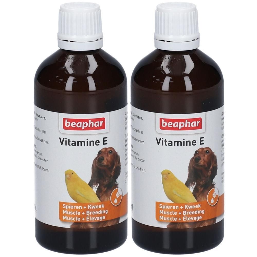 Twee flessen Beaphar Vitamine E olie voor dieren. Bruine glazen flessen met witte dop.