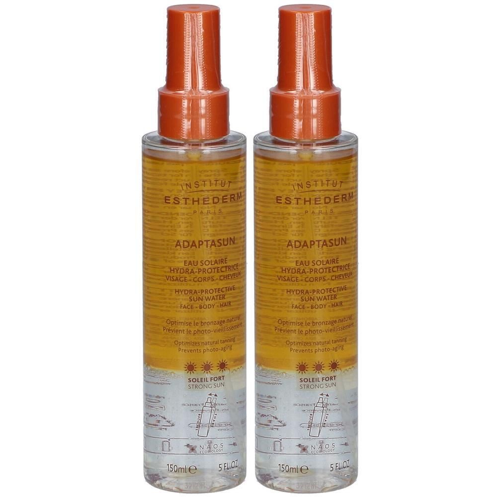 Twee flacons Institut Esthederm Adaptasun zonnespray met oranje sproeikoppen. 150ml.