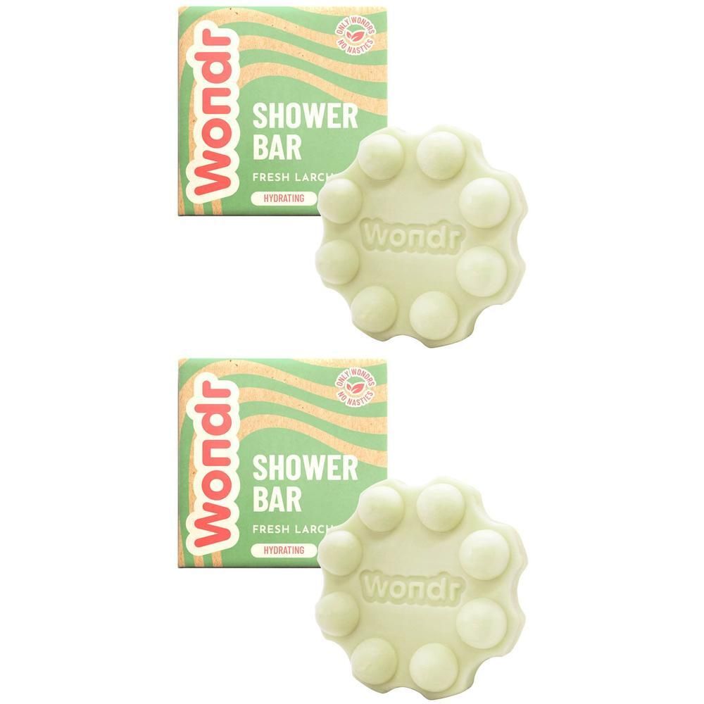 Twee Wondr douchebars in bloemvorm met 10 noppen. Groene verpakking met golvend patroon.
