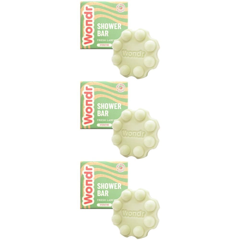 Drie Wondr douchebars in bloemvorm met noppen, verpakt in groene doosjes.