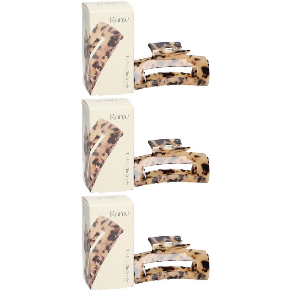 Trois pinces à cheveux style écaille de tortue sable, chacune dans sa boîte.