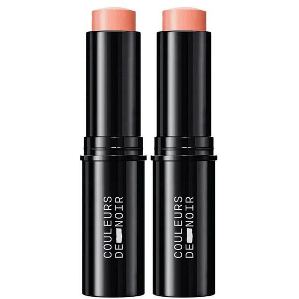 Twee zwarte sticks met een perzikkleurige blush stick.