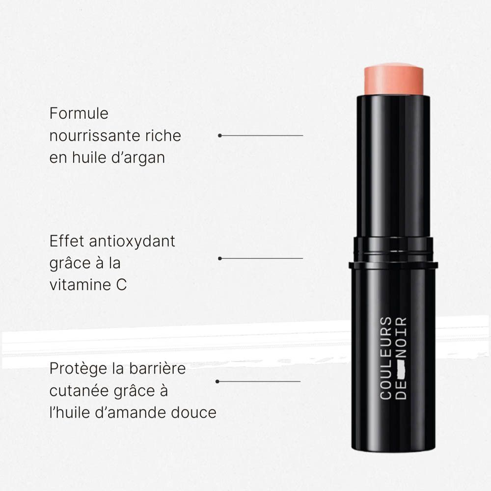 Stick de blush crémeux pêche, boîtier noir. Formule nourrissante à l'huile d'argan.