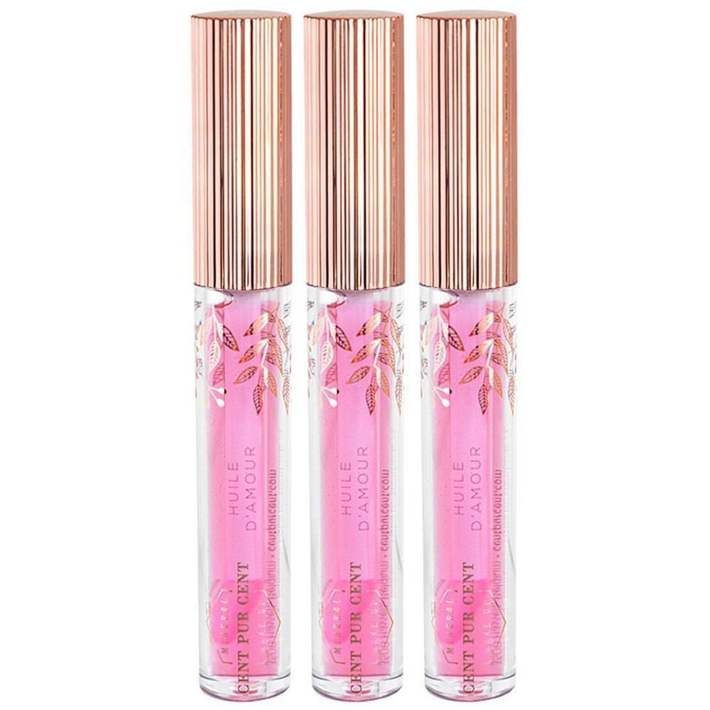 Drie Cent Pur Cent Huile d'Amour lipoliën in doorzichtige flesjes met roségouden doppen.